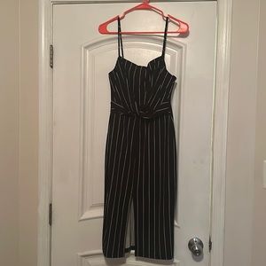 Little Black Dress with white pinstripes. Slit down the middle. Fitted and fun!